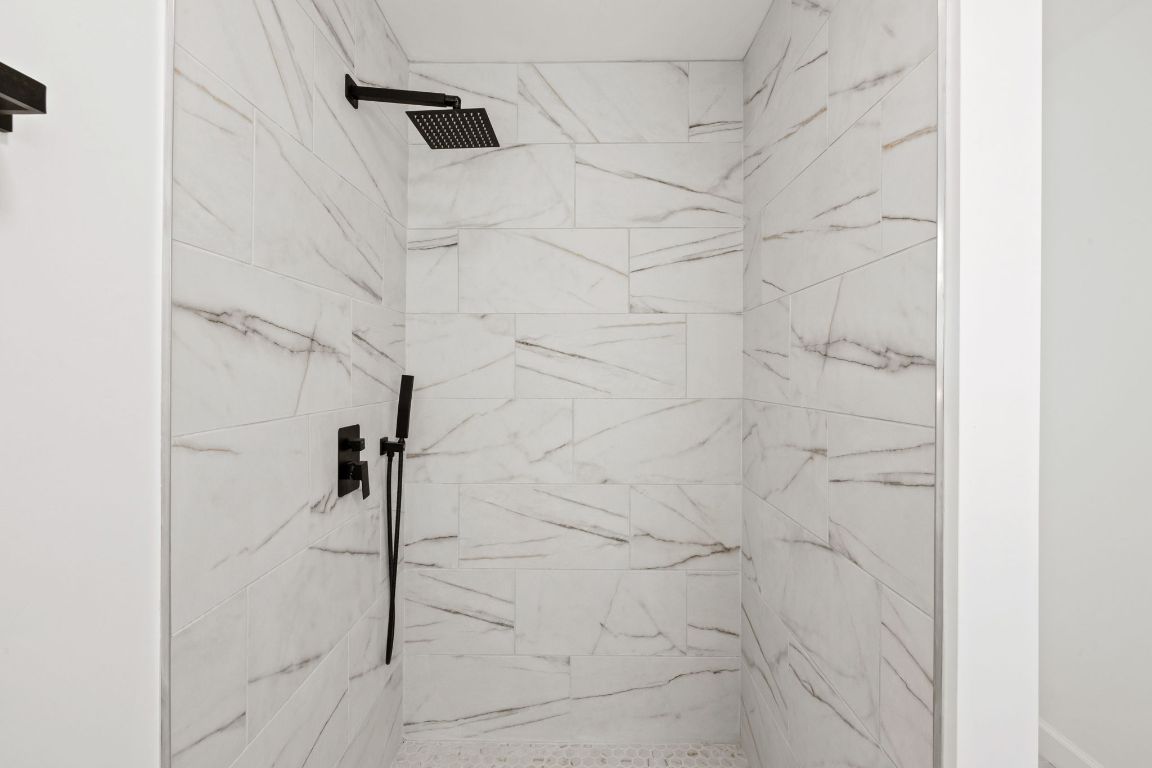 902 Virginia Drive Round Rock, TX 78664 - Photo 19 of 33 a bathroom with a shower