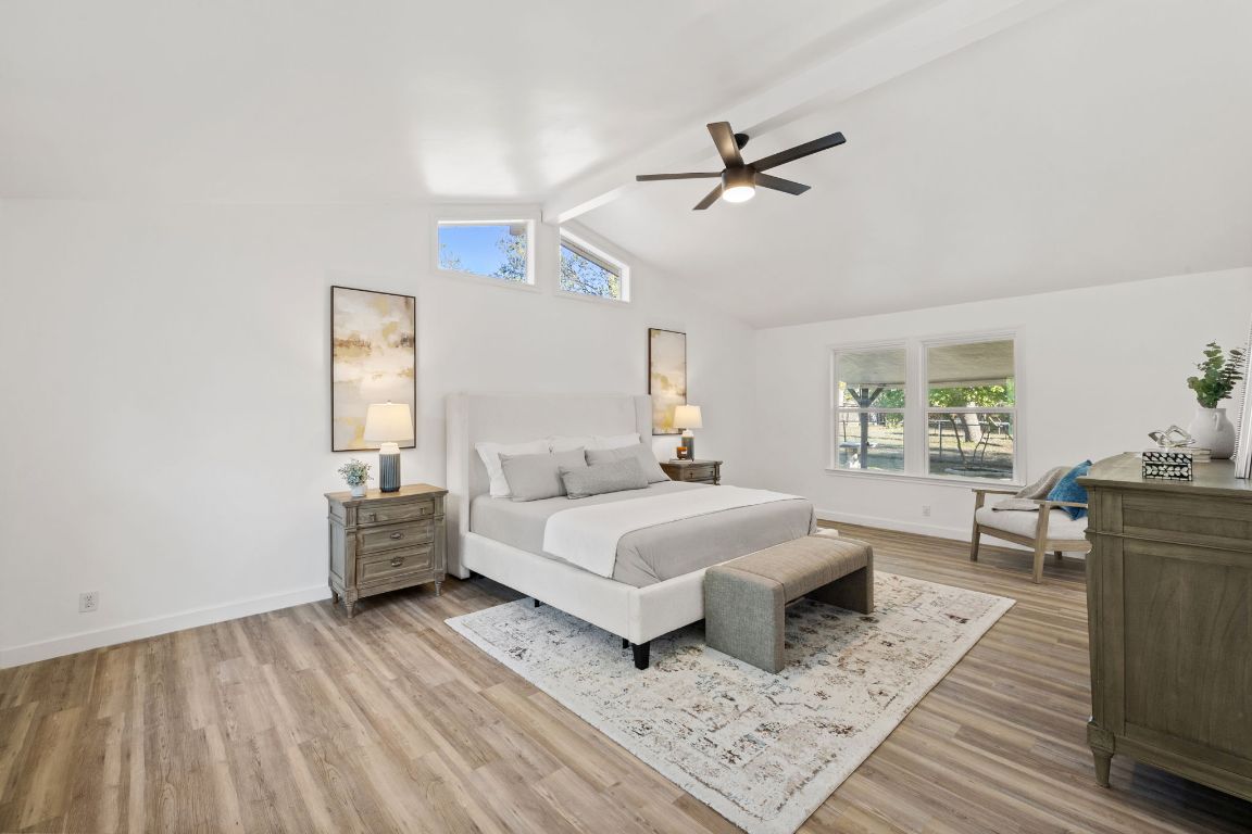 902 Virginia Drive Round Rock, TX 78664 - Photo 27 of 33 a room with a bed and wooden floor