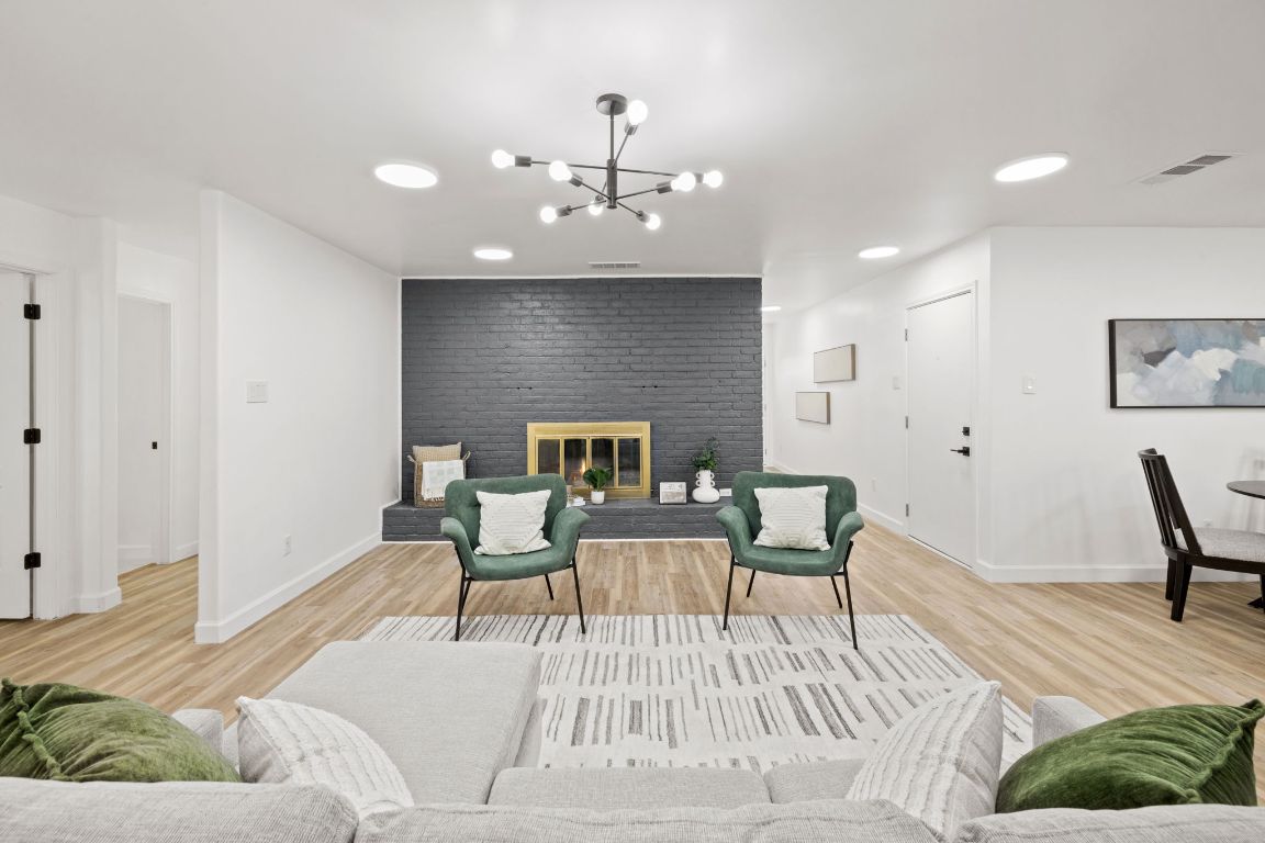902 Virginia Drive Round Rock, TX 78664 - Photo 7 of 33 a living room with furniture and a fireplace