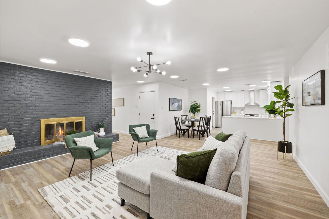 902 Virginia Drive Round Rock, TX 78664 - Photo 9 of 33 a living room with furniture and wooden floor