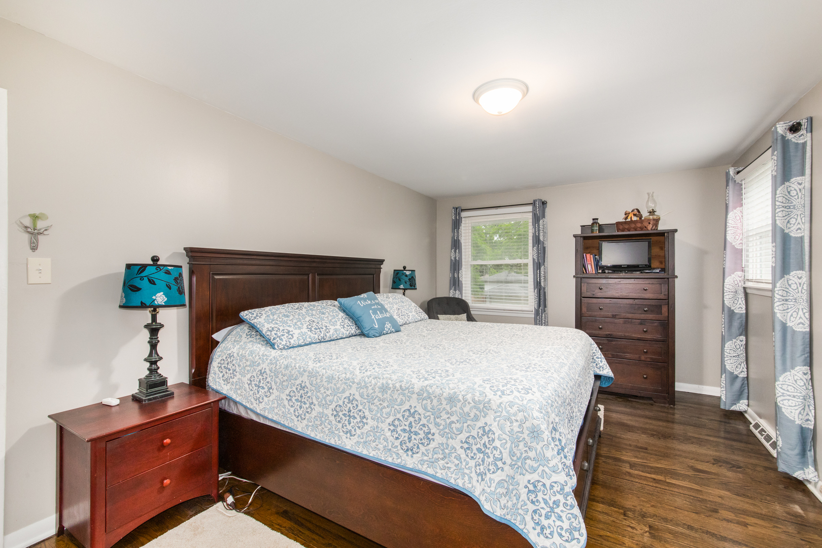 2005 Cayuga Lane Mount Prospect, IL 60056 - Photo 12 of 28 a bedroom with a bed and wooden floor