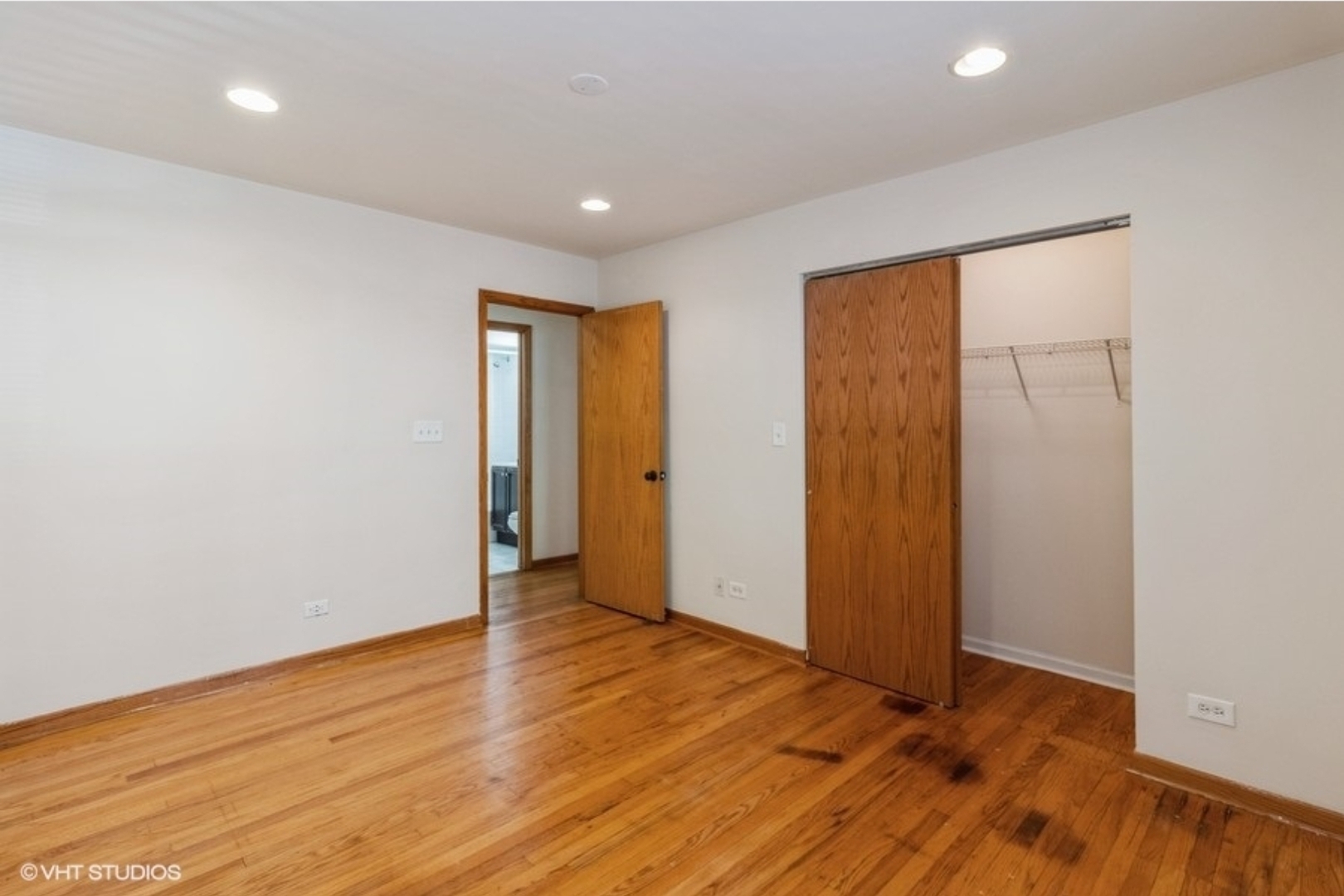 Undisclosed Address Chicago, IL 60647 - Photo 12 of 15 an empty room with wooden floor and closet