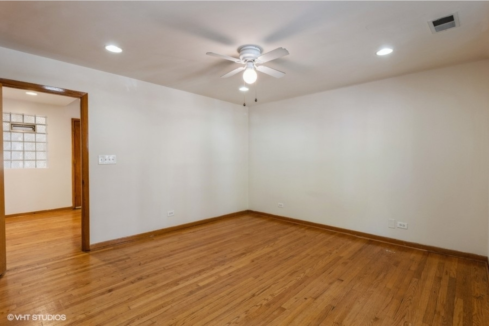 Undisclosed Address Chicago, IL 60647 - Photo 13 of 15 an empty room with wooden floor and windows