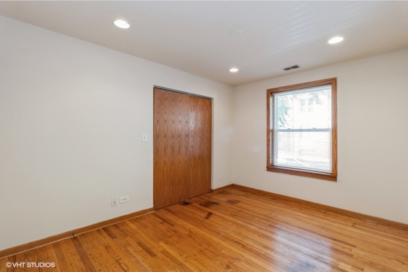Undisclosed Address Chicago, IL 60647 - Photo 14 of 15 an empty room with wooden floor and windows