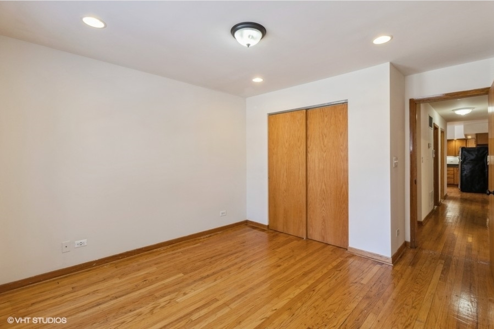 Undisclosed Address Chicago, IL 60647 - Photo 8 of 15 an empty room with wooden floor and windows