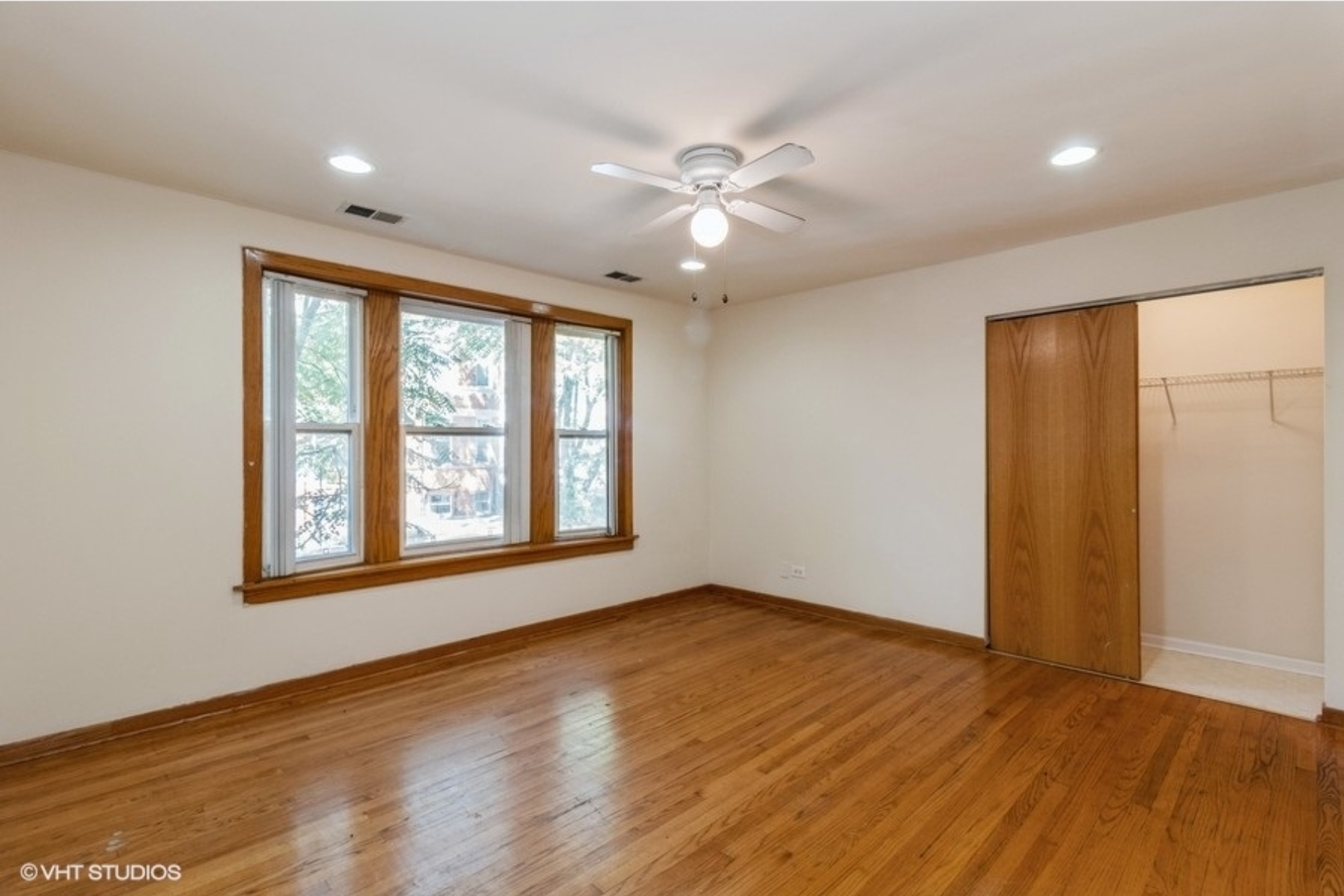 Undisclosed Address Chicago, IL 60647 - Photo 10 of 15 a view of an empty room with wooden floor and a window