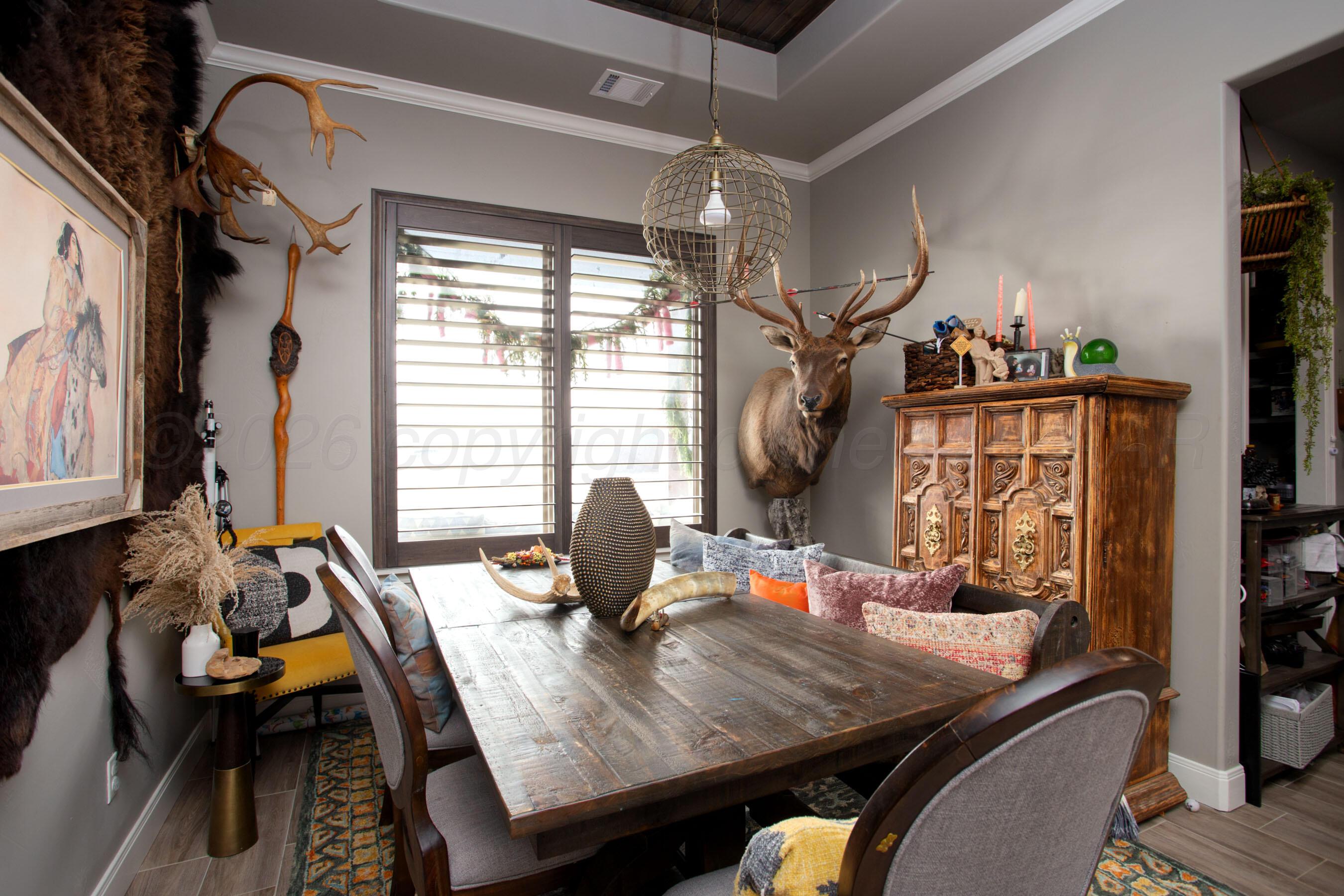 8200 Matilda Lane Amarillo, TX 79119 - Photo 12 of 39 a view of a dining room with furniture window and outside view