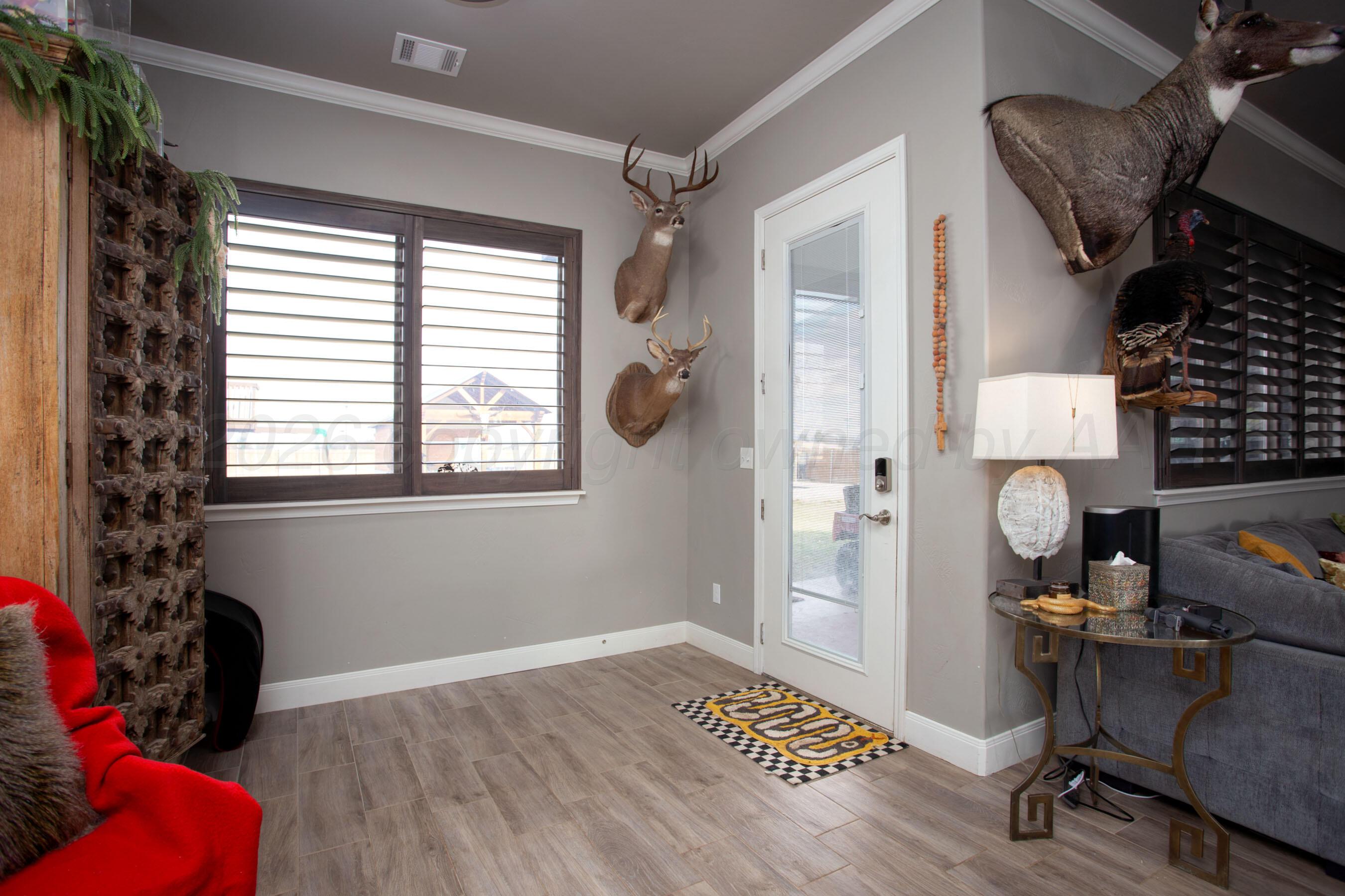 8200 Matilda Lane Amarillo, TX 79119 - Photo 14 of 39 a view of a workspace with furniture and a window
