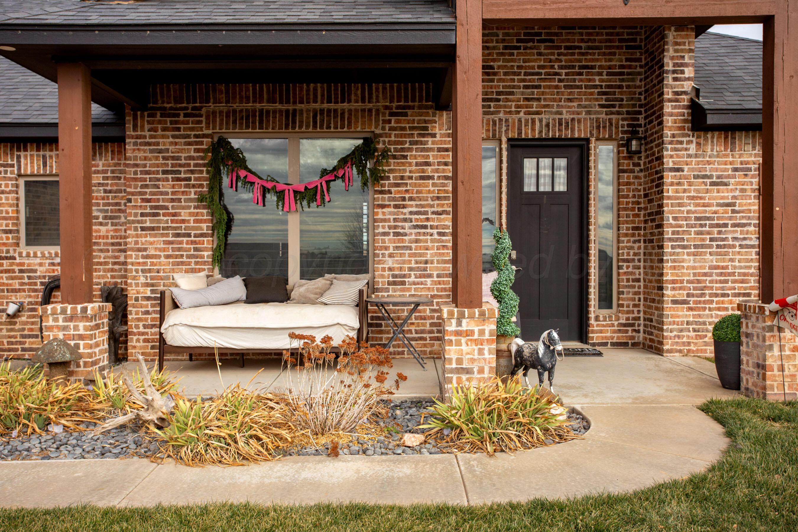 8200 Matilda Lane Amarillo, TX 79119 - Photo 2 of 39 a view of a patio with table and chairs and potted plants