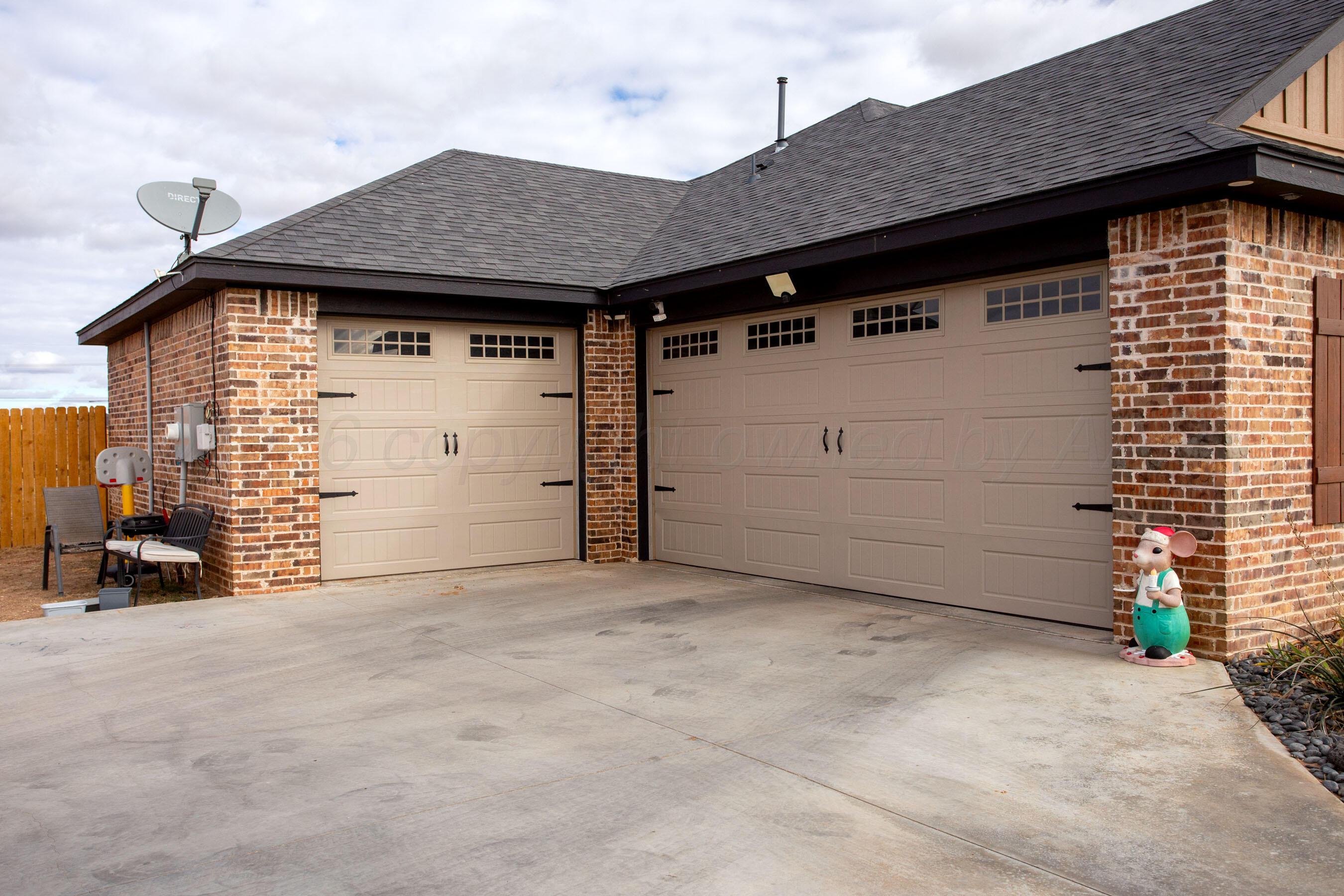 8200 Matilda Lane Amarillo, TX 79119 - Photo 34 of 39 a view of a house with yard and garage