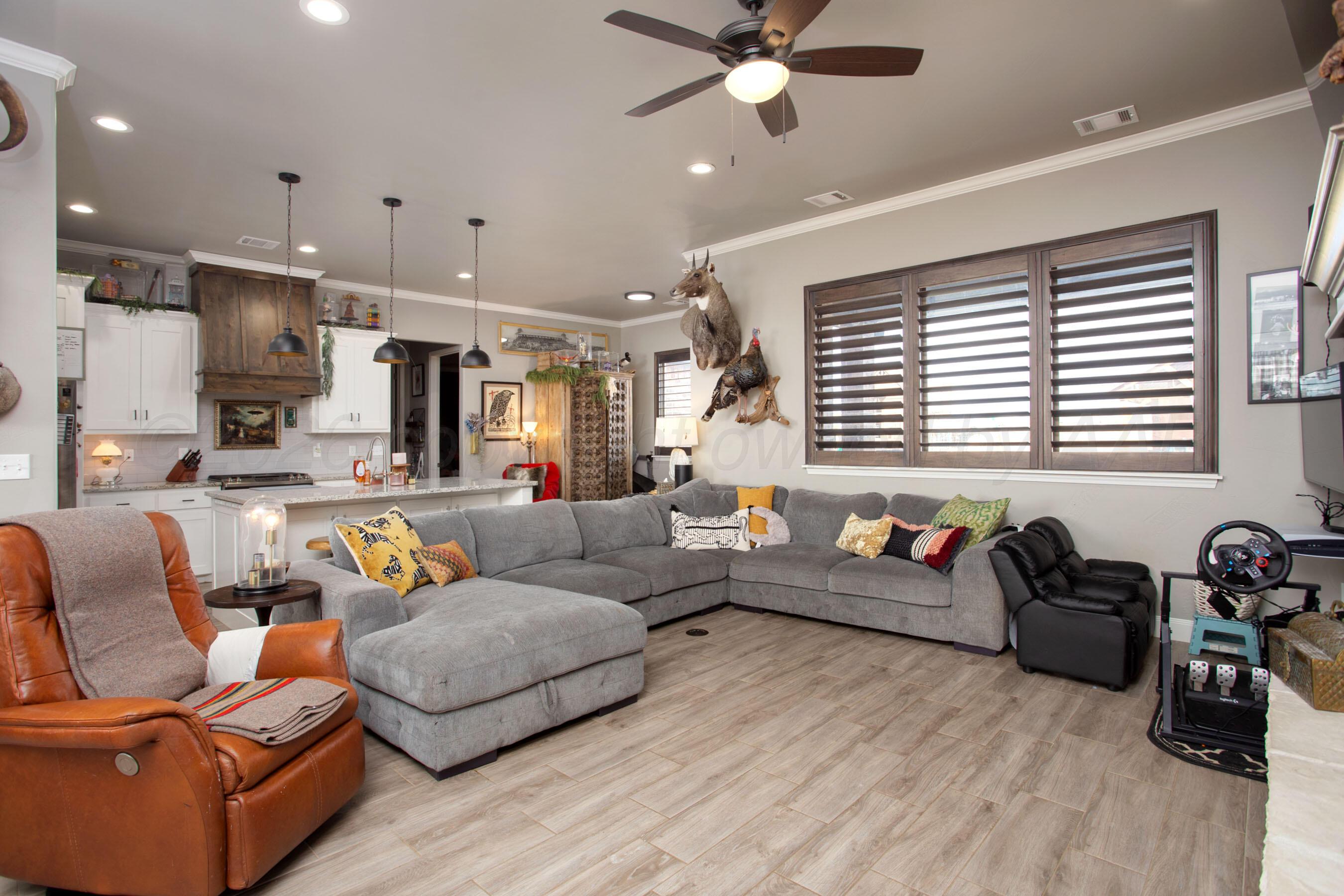 8200 Matilda Lane Amarillo, TX 79119 - Photo 4 of 39 a living room with furniture and a wooden floor