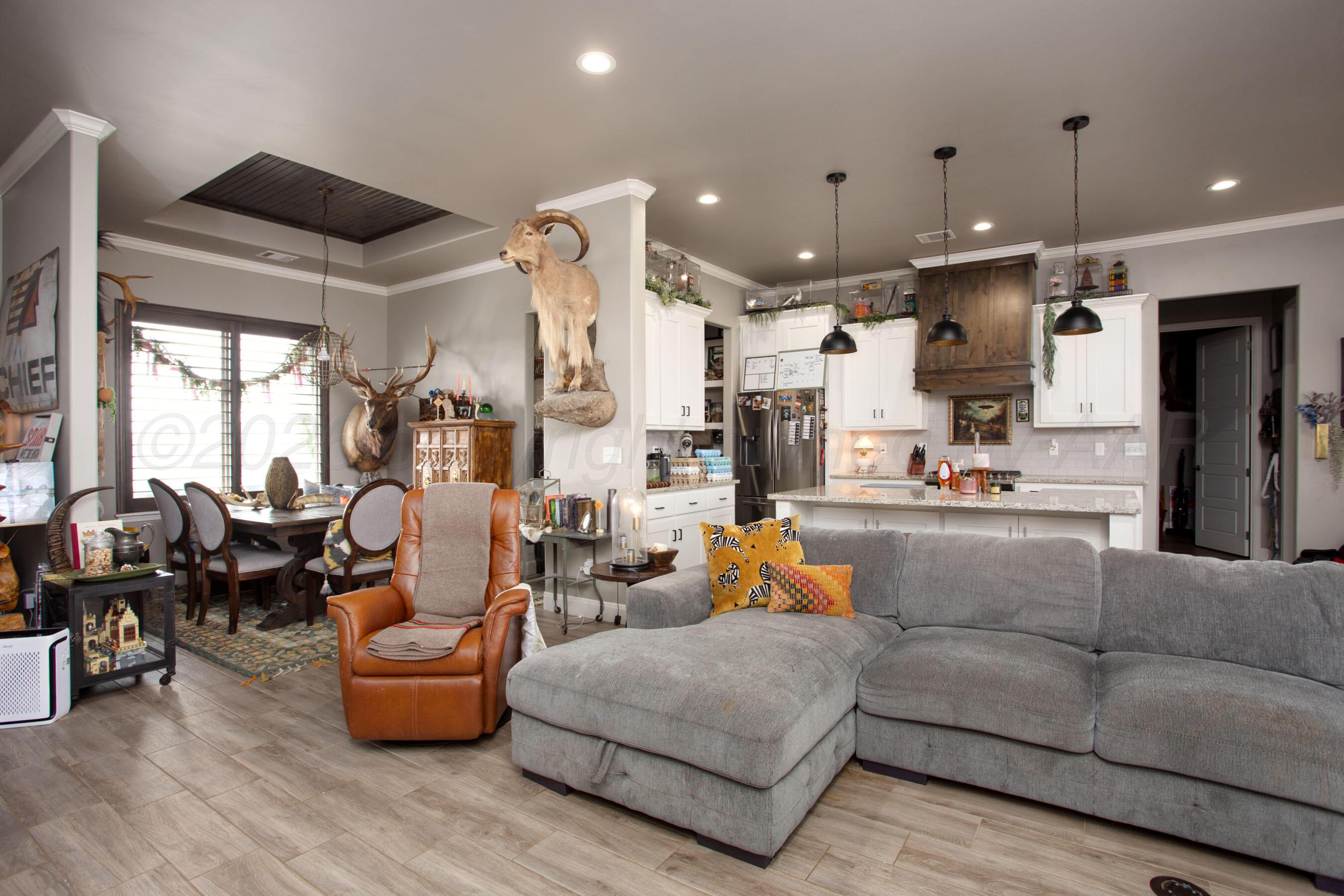 8200 Matilda Lane Amarillo, TX 79119 - Photo 5 of 39 a living room with furniture kitchen area and a large window
