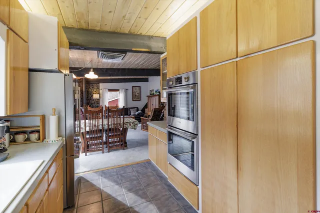a view of kitchen with furniture and wooden floor