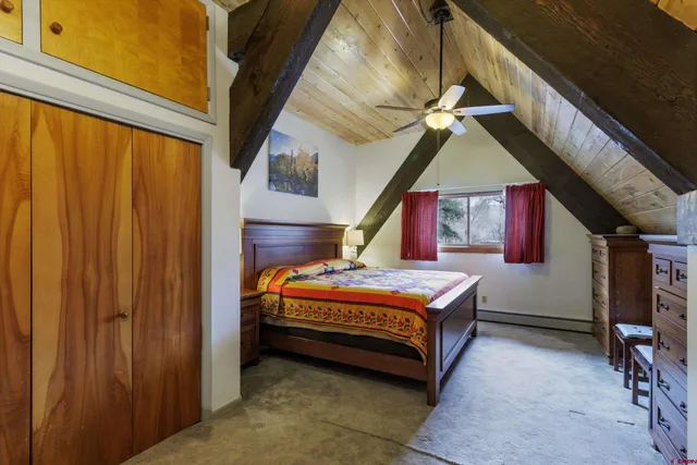 a room with a bed and a chandelier