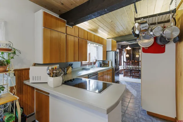 a kitchen with a sink and a refrigerator