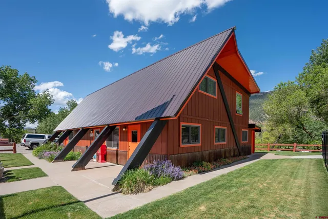 a view of house with yard and entertaining space