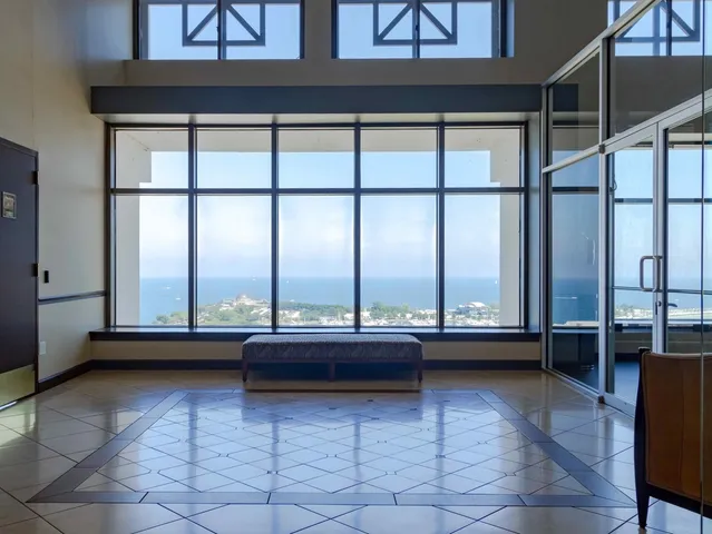 a room with a large window and table