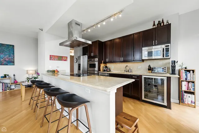 a kitchen with a sink cabinets and window