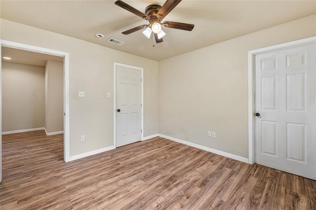409 Morgan Mill Road Stephenville, TX 76401 - Photo 14 of 25 a view of empty room with wooden floor