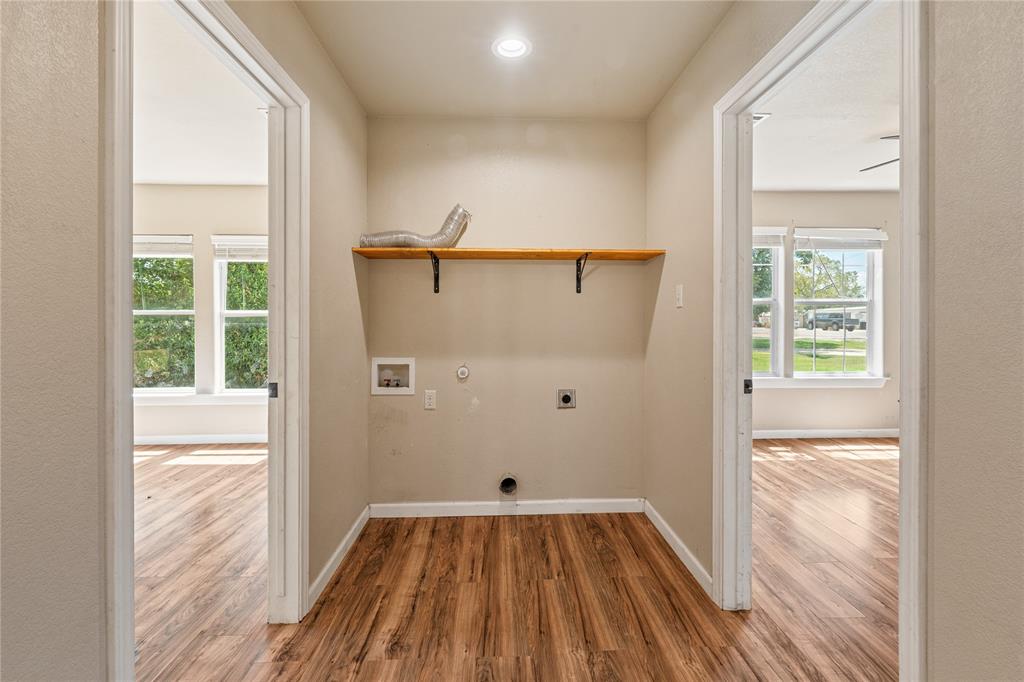 409 Morgan Mill Road Stephenville, TX 76401 - Photo 20 of 25 a view of a room with wooden floor and small space