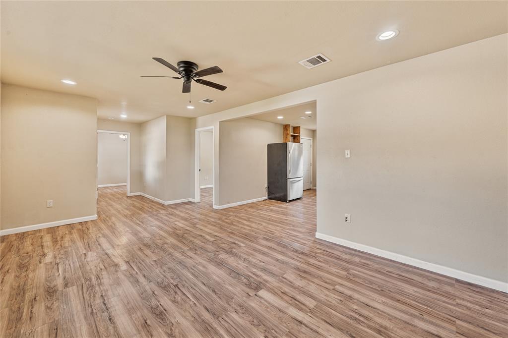 409 Morgan Mill Road Stephenville, TX 76401 - Photo 6 of 25 a view of a livingroom with a ceiling fan & entryway