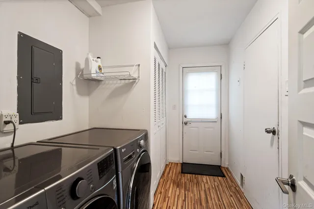 a utility room with a sink dryer and washer
