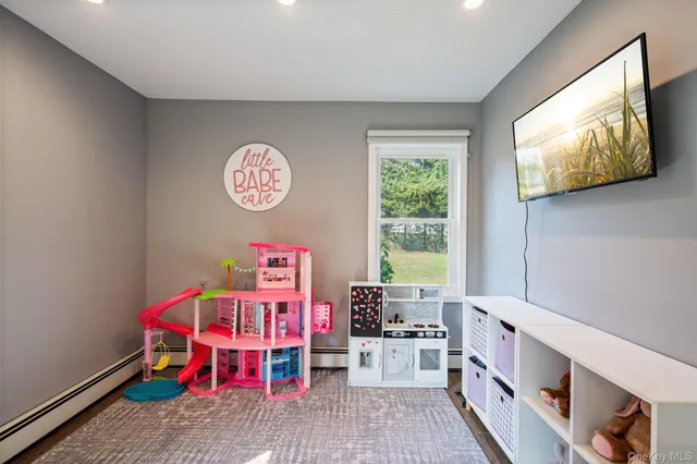 a view of play room with windows