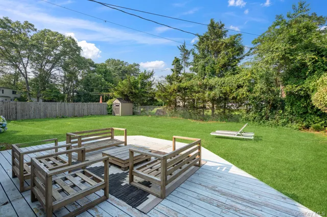 a view of a chairs and table on the deck