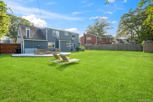 a view of a house with a yard porch and sitting area