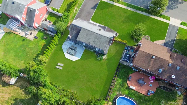 an aerial view of a house with a garden