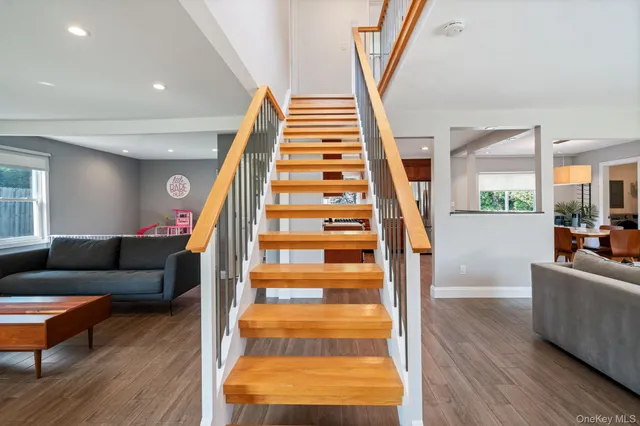 a view of entryway with furniture and wooden floor