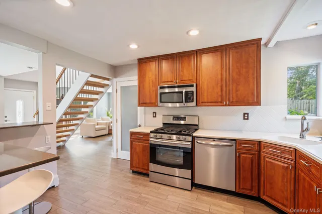 a kitchen with wooden cabinets and white appliances