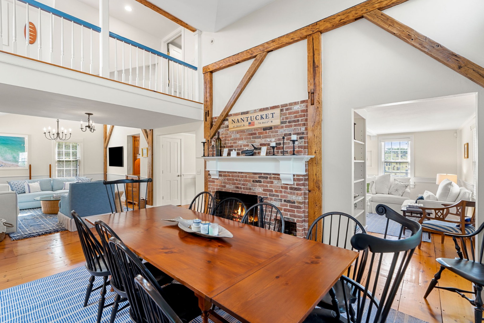 39 A Milk Street Nantucket, MA 02554 - Photo 11 of 56 a view of a dining room with furniture window and wooden floor