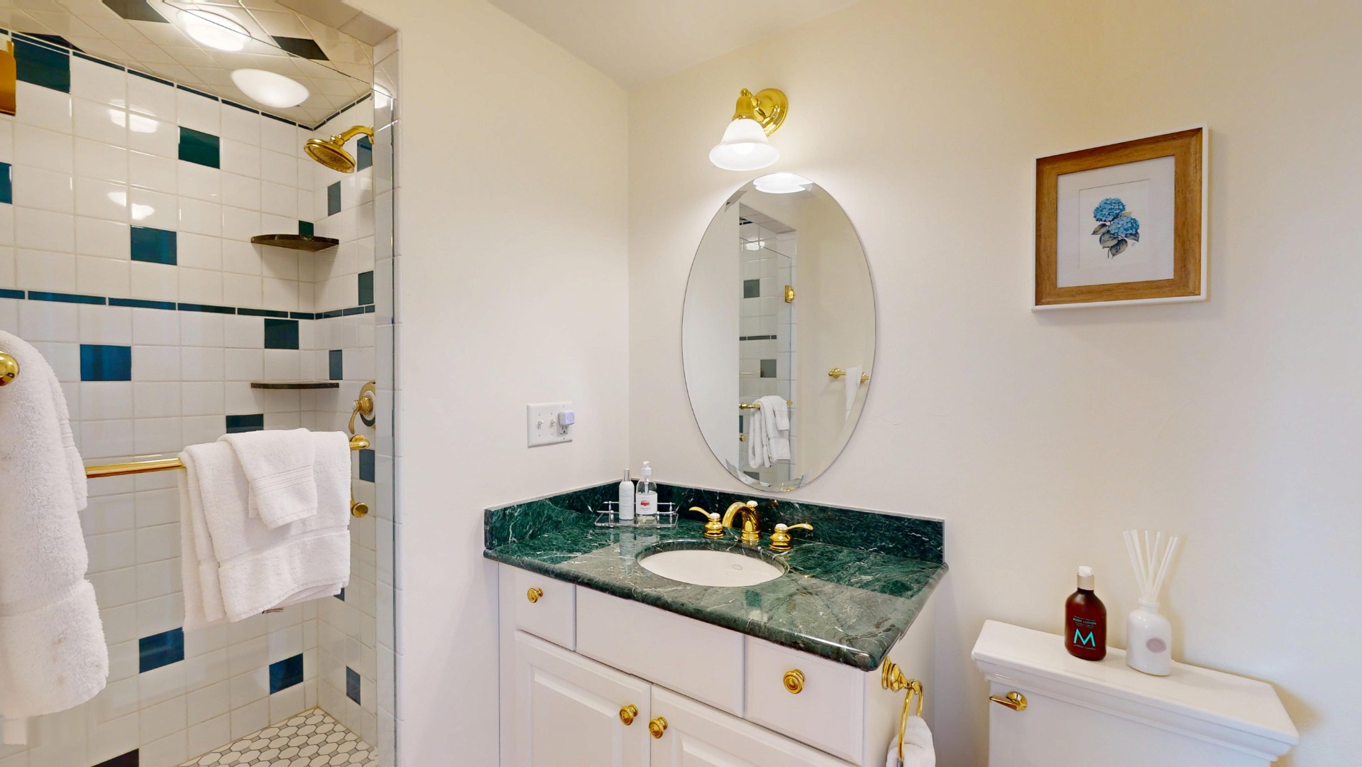 39 A Milk Street Nantucket, MA 02554 - Photo 25 of 56 a bathroom with a granite countertop sink and a mirror