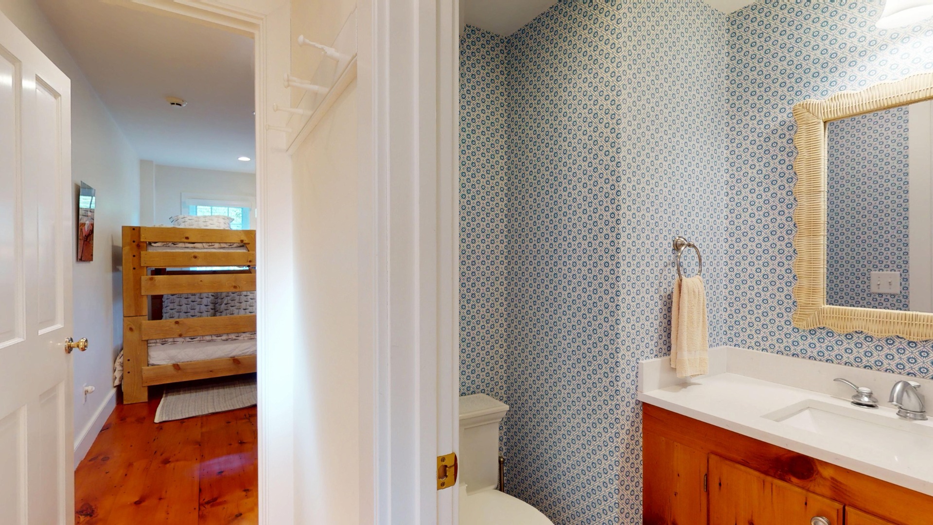 39 A Milk Street Nantucket, MA 02554 - Photo 26 of 56 a bathroom with a sink and a mirror