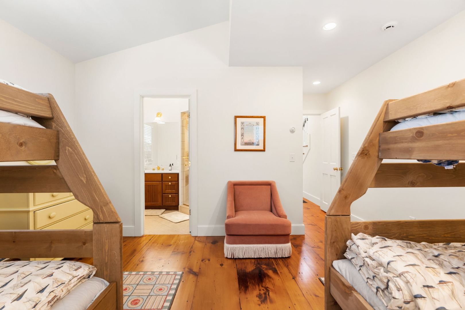 39 A Milk Street Nantucket, MA 02554 - Photo 29 of 56 a living room with furniture and a painting on the wall