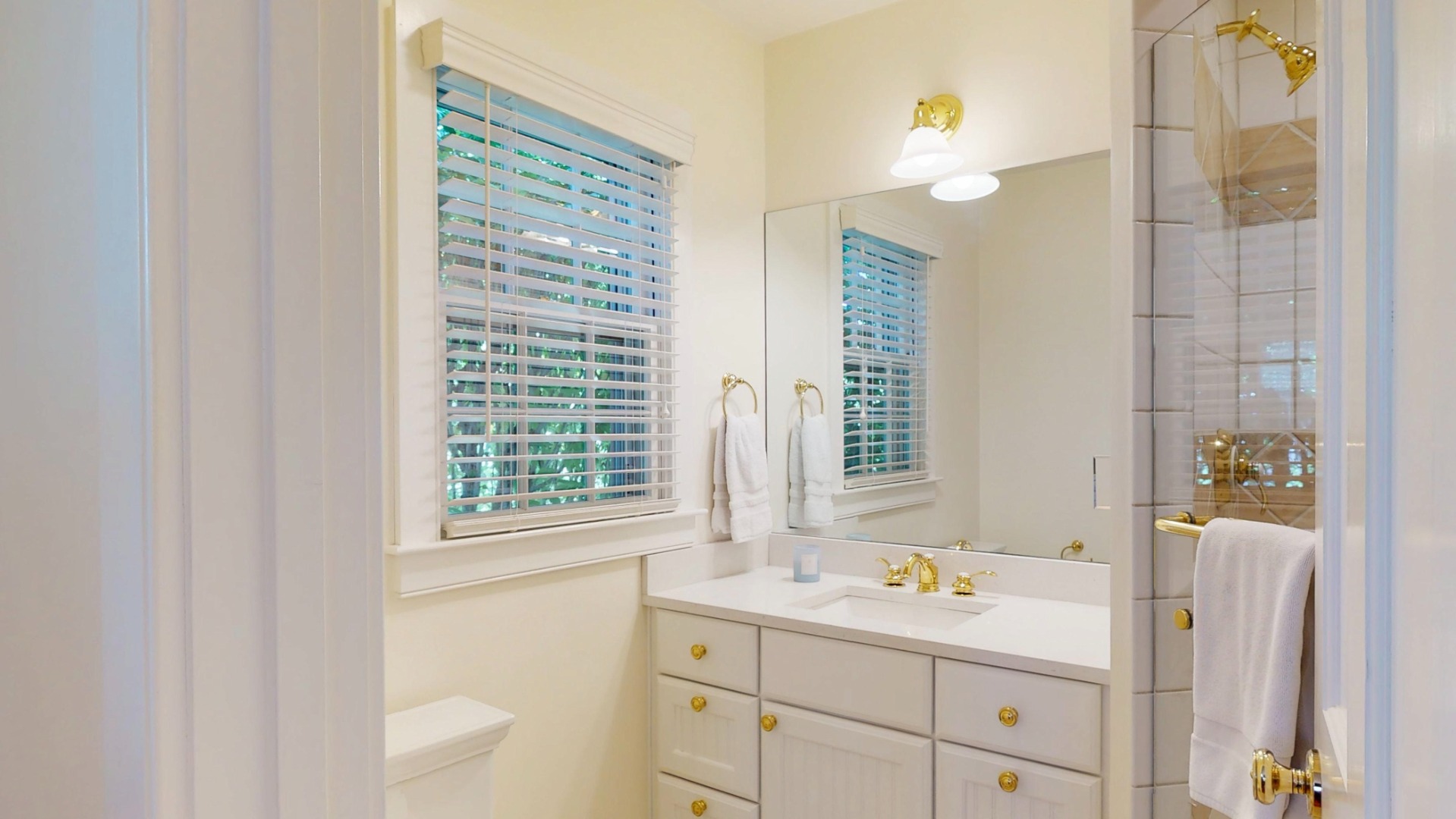 39 A Milk Street Nantucket, MA 02554 - Photo 31 of 56 a bathroom with a sink a toilet and a window
