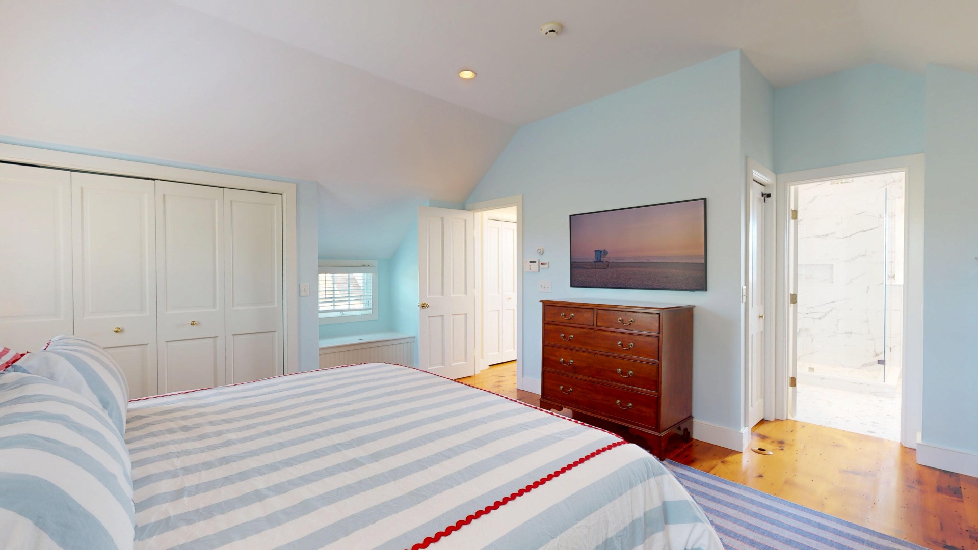 39 A Milk Street Nantucket, MA 02554 - Photo 35 of 56 a bedroom with a bed and a flat screen tv