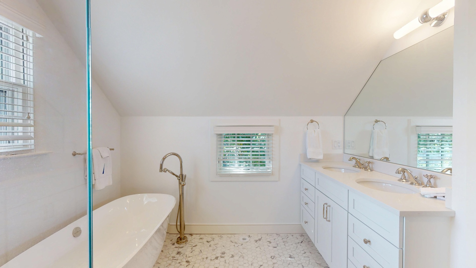 39 A Milk Street Nantucket, MA 02554 - Photo 37 of 56 a bathroom with a tub sink and mirror
