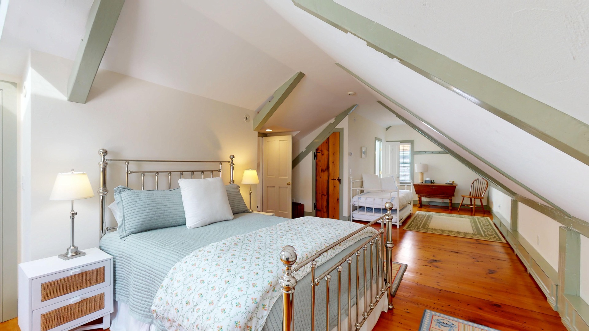 39 A Milk Street Nantucket, MA 02554 - Photo 38 of 56 a bedroom with a bed and a lamp