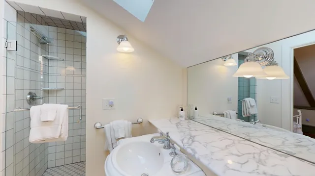 a bedroom with a bed and a table in it