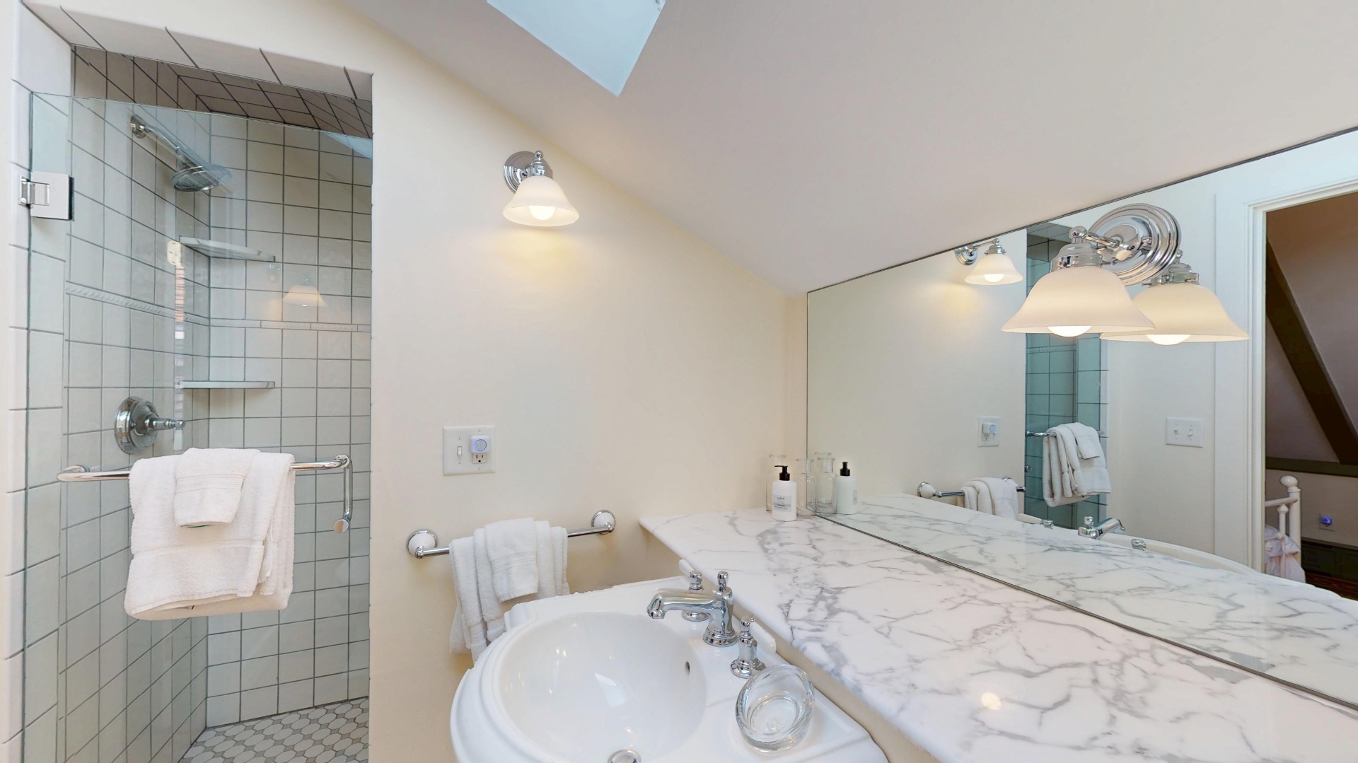 39 A Milk Street Nantucket, MA 02554 - Photo 43 of 56 a bathroom with a sink and mirror