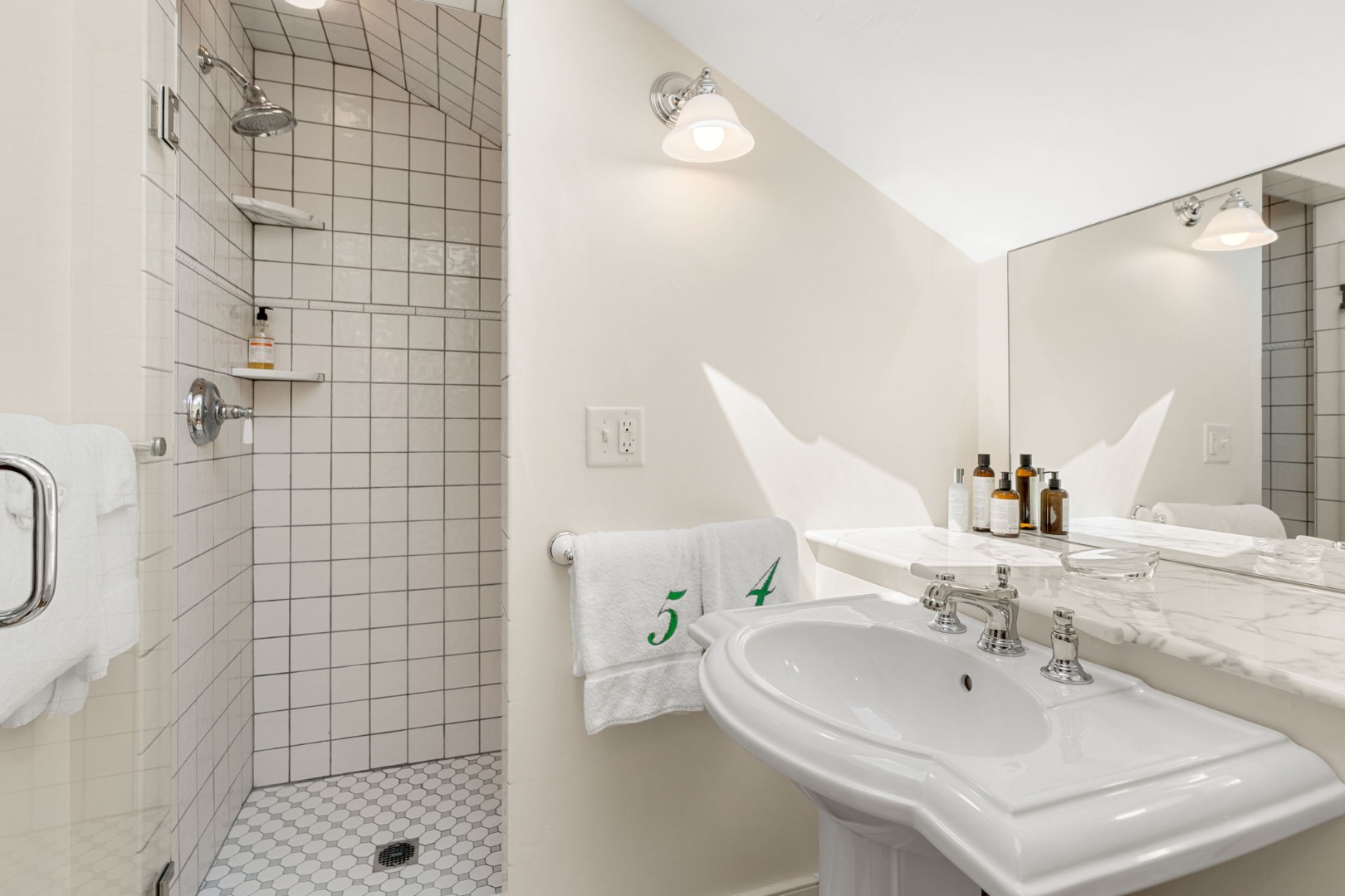 39 A Milk Street Nantucket, MA 02554 - Photo 44 of 56 a bathroom with a sink a toilet and shower