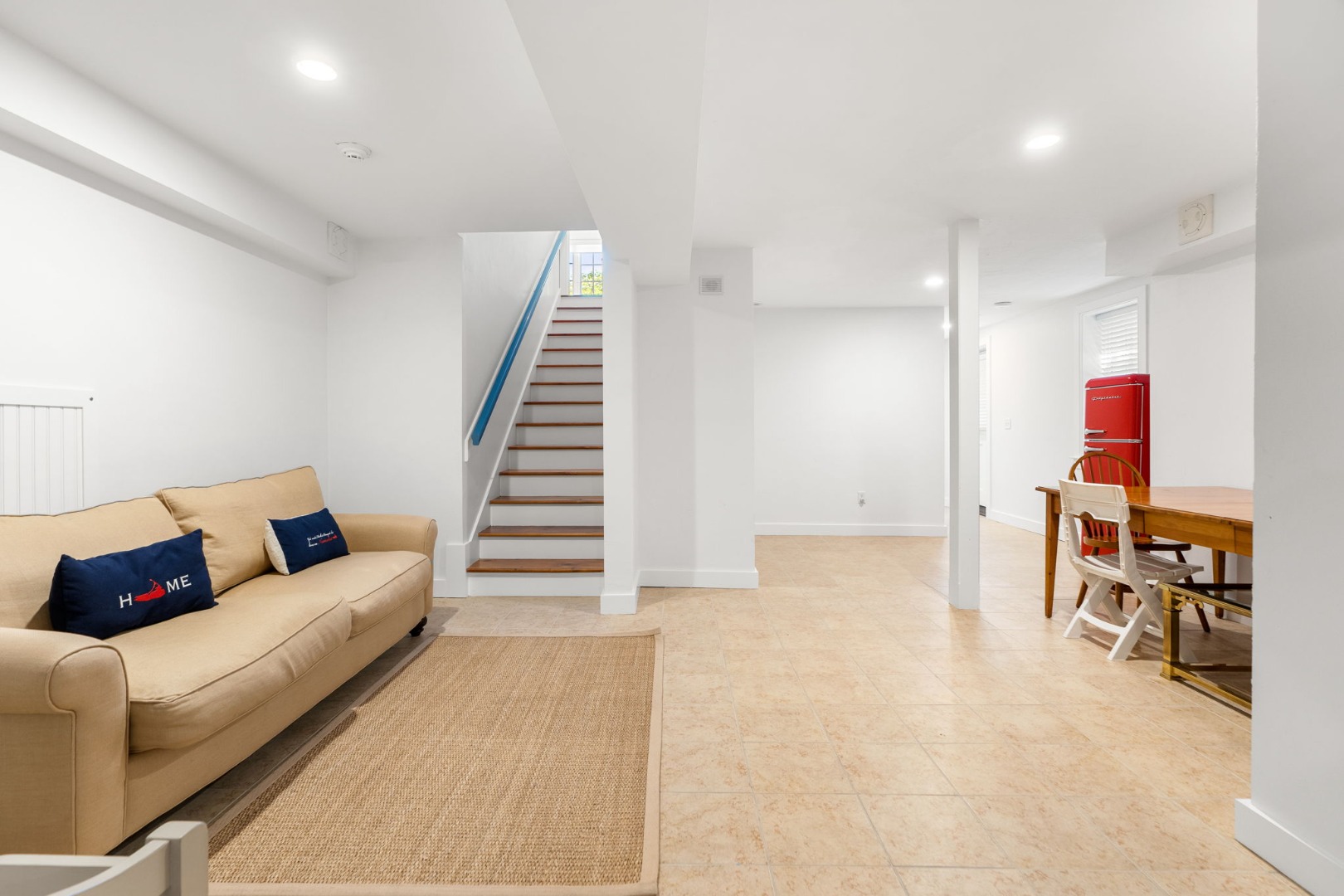 39 A Milk Street Nantucket, MA 02554 - Photo 47 of 56 a living room with furniture and a couch