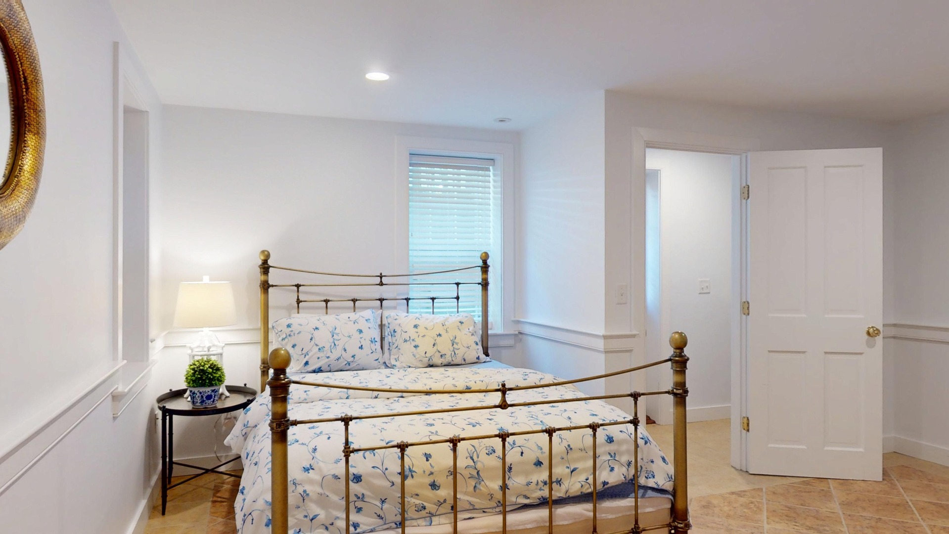 39 A Milk Street Nantucket, MA 02554 - Photo 49 of 56 a bedroom with a bed and a table in it