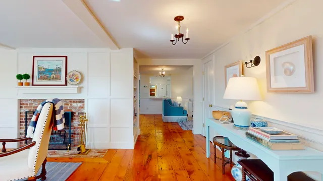a living room with furniture a rug and a window
