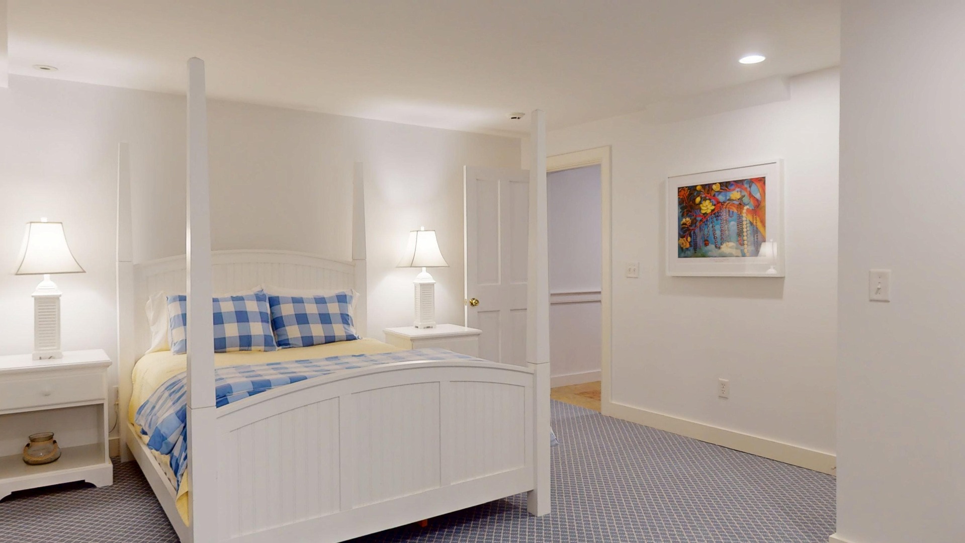 39 A Milk Street Nantucket, MA 02554 - Photo 51 of 56 a room with a bed and a painting on the wall