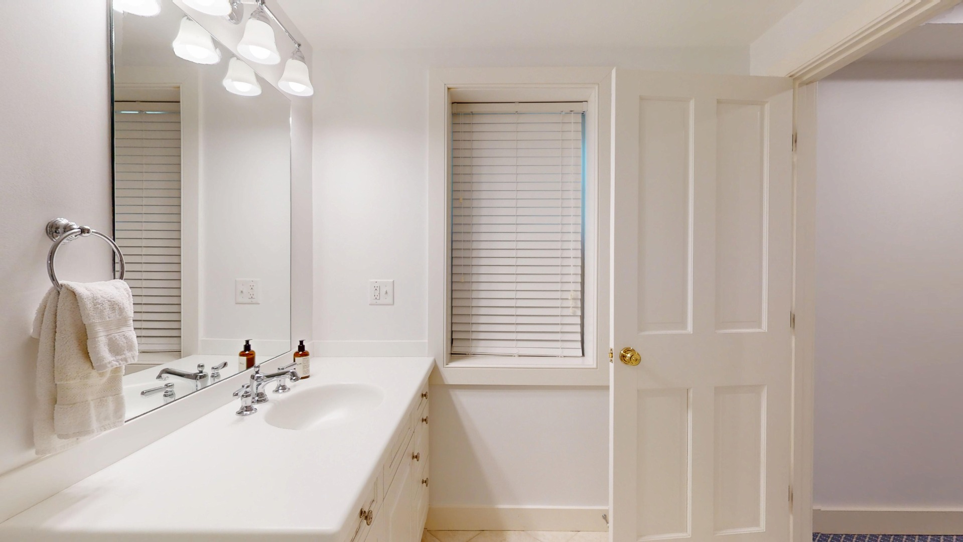 39 A Milk Street Nantucket, MA 02554 - Photo 52 of 56 a bathroom with a bathtub a sink and a mirror