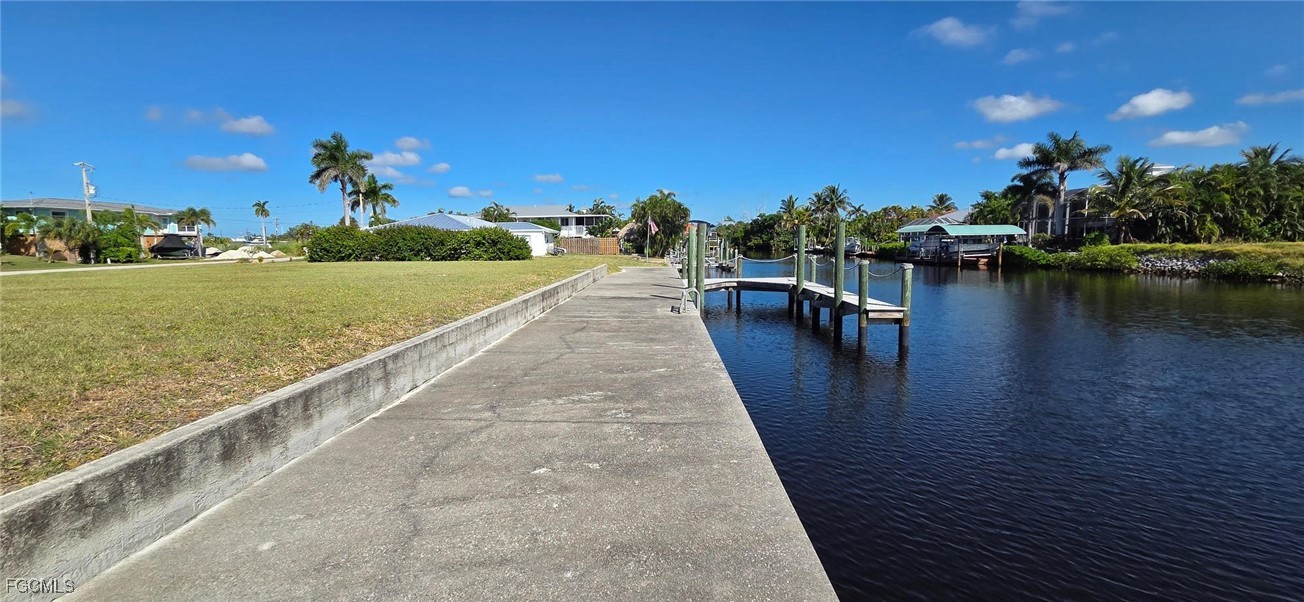 3210 Stabile Road St. James City, FL 33956 - Photo 11 of 14 a view of a lake with a house