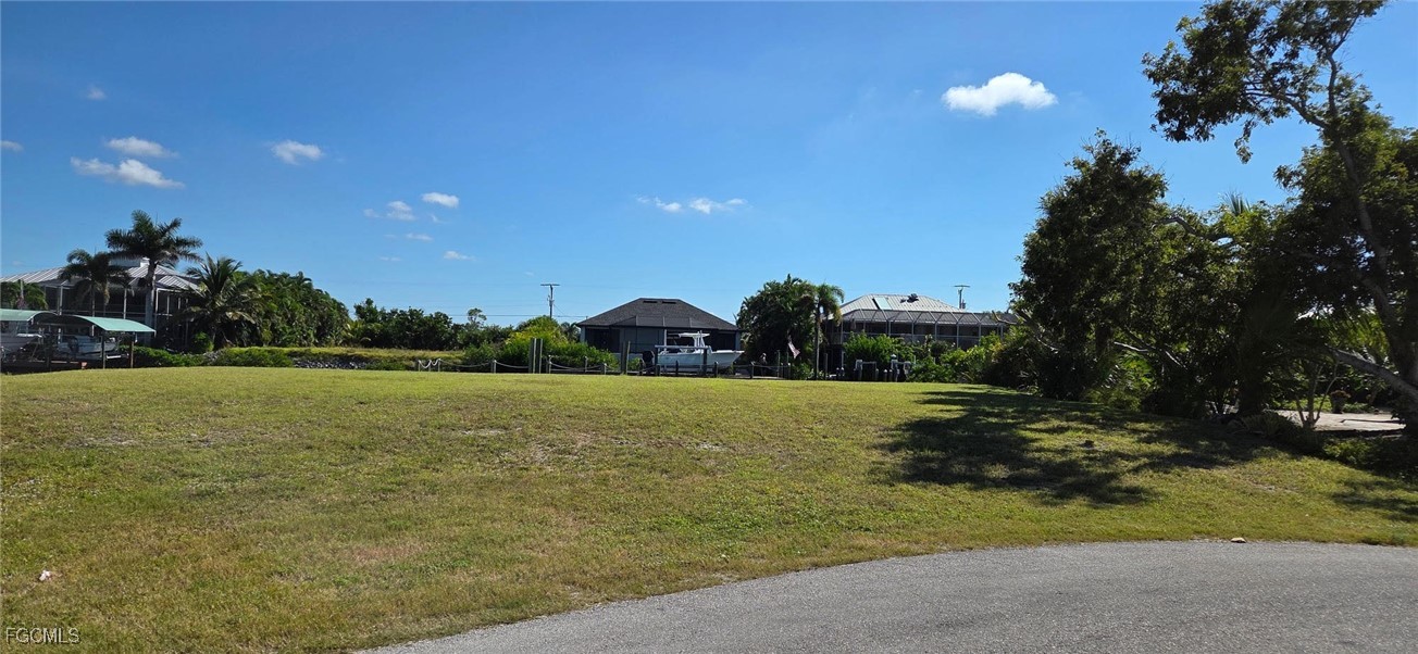 3210 Stabile Road St. James City, FL 33956 - Photo 5 of 14 a view of a lake with a house in the background